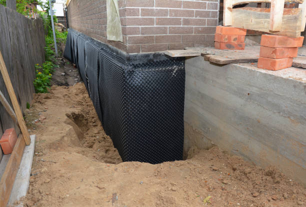 Happy homeowners after waterproofing job in Henderson